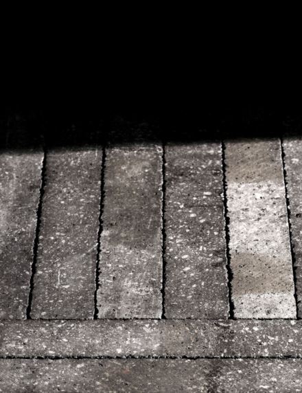 Premium lava stone surface, untreated, in a warm brown finish.