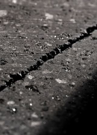 Uncoated lava stone surface with mineral-rich veins, perfect for modern designs.