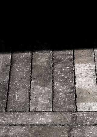 Premium lava stone surface, untreated, in a warm brown finish.